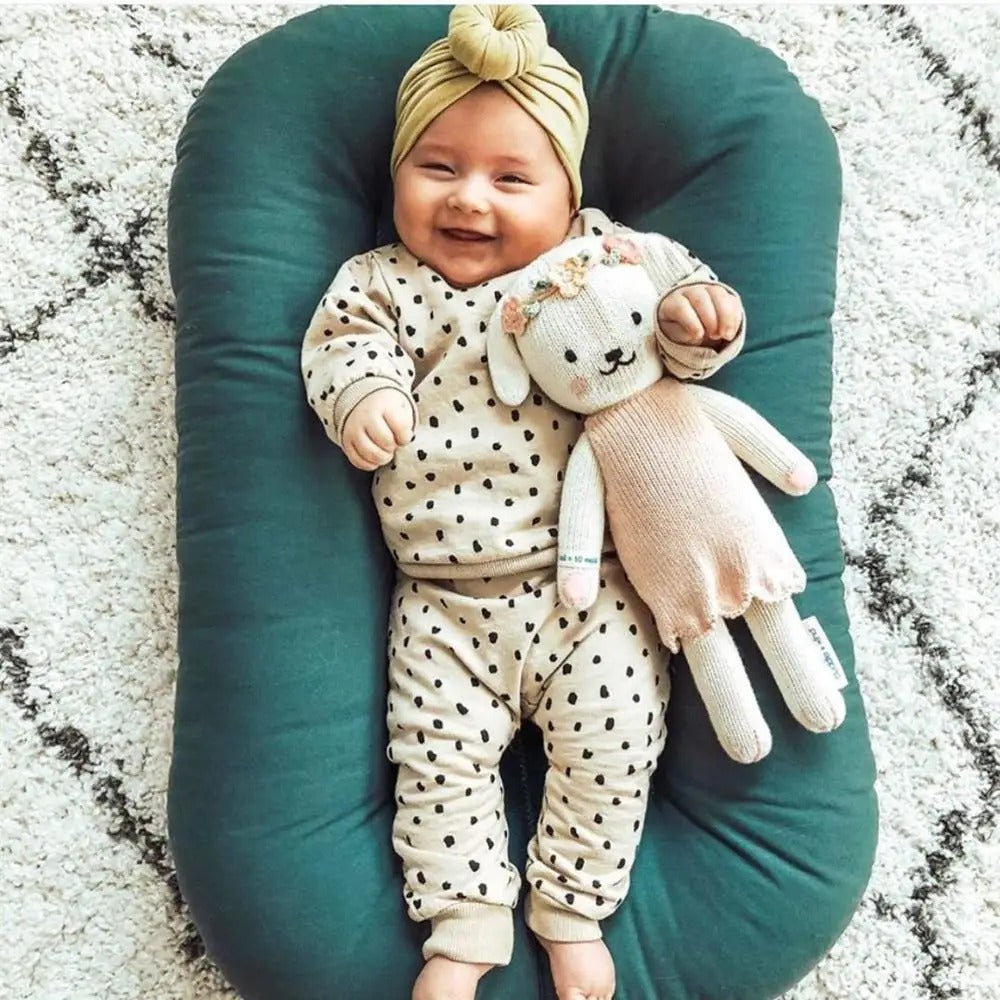 réducteur de lit réconforte bébé 